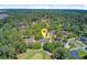 Aerial view of a beautiful home in a wooded neighborhood with mature shade trees at 4227 Sawgrass Dr, North Charleston, SC 29420