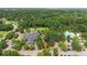 Beautiful aerial view of the Coosaw Creek community center and pool nestled amongst lush greenery at 4227 Sawgrass Dr, North Charleston, SC 29420