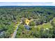 Aerial view of a beautiful home in a wooded neighborhood near a golf course at 4227 Sawgrass Dr, North Charleston, SC 29420