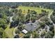 Aerial shot featuring the Coosaw Creek clubhouse, pool, golf course, and tennis courts at 4227 Sawgrass Dr, North Charleston, SC 29420