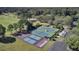 Aerial view of the community's recreational courts, surrounded by lush greenery, golf course and parking at 4227 Sawgrass Dr, North Charleston, SC 29420