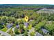 Stunning aerial view of a home on a golf course with lush landscaping and mature trees at 4227 Sawgrass Dr, North Charleston, SC 29420