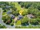 Aerial view of a home near a golf course in a neighborhood with mature shade trees at 4227 Sawgrass Dr, North Charleston, SC 29420