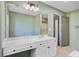 This bathroom features a vanity with a large mirror and a door to the toilet and shower area at 4227 Sawgrass Dr, North Charleston, SC 29420
