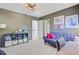 This bedroom features a sofa, artwork, and storage shelving at 4227 Sawgrass Dr, North Charleston, SC 29420