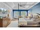 Bedroom features a canopy bed, blue walls, a tray ceiling, and natural light from large windows at 4227 Sawgrass Dr, North Charleston, SC 29420