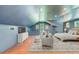 Bright, lofted bedroom featuring hardwood floors, recessed lighting, and sitting area at 4227 Sawgrass Dr, North Charleston, SC 29420