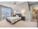 This bedroom features a large window, carpet, ceiling fan, and closet at 4227 Sawgrass Dr, North Charleston, SC 29420