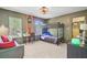 This bedroom features a bunk bed, windows, a sofa, and a ceiling fan at 4227 Sawgrass Dr, North Charleston, SC 29420