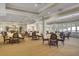 Spacious dining room filled with tables and chairs, perfect for hosting events and gatherings at 4227 Sawgrass Dr, North Charleston, SC 29420
