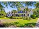 Beautiful two-story home with a spacious yard and lush landscaping at 4227 Sawgrass Dr, North Charleston, SC 29420