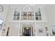 Grand foyer with a view of the upper level, hardwood floors, and natural light from the front door at 4227 Sawgrass Dr, North Charleston, SC 29420