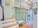 Inviting foyer with coat hooks, a bench, and an attractive mirror at 4227 Sawgrass Dr, North Charleston, SC 29420