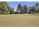 Scenic golf course view, showcasing the lush green, manicured lawns, and clear blue skies in the background at 4227 Sawgrass Dr, North Charleston, SC 29420