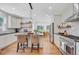 Bright kitchen with stone countertops, an island with seating, and stainless steel appliances at 4227 Sawgrass Dr, North Charleston, SC 29420