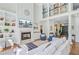 Spacious living room featuring a fireplace, hardwood floors, a soaring ceiling, and an open layout at 4227 Sawgrass Dr, North Charleston, SC 29420