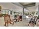 Charming outdoor porch featuring rocking chairs, bench seating, and serene views of the community at 4227 Sawgrass Dr, North Charleston, SC 29420