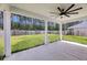 Large, fenced backyard with a covered patio and ceiling fan perfect for outdoor entertaining at 4308 Cotton Flt Rd, Summerville, SC 29485