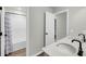 Bathroom featuring double sinks, modern fixtures, and a shower with a decorative curtain at 4308 Cotton Flt Rd, Summerville, SC 29485