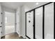 Bathroom featuring a bright white shower stall with sleek black frame and convenient built in shelves at 4308 Cotton Flt Rd, Summerville, SC 29485