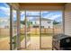 A screened-in back porch overlooks the backyard, with a grill, perfect for outdoor gatherings at 513 Donnas View Way, Summerville, SC 29486