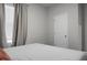 Bright bedroom features a comfortable bed, neutral color scheme, and plenty of natural light from the window at 513 Donnas View Way, Summerville, SC 29486
