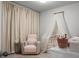 This Bedroom features a crib, and comfortable armchair for a tranquil space at 513 Donnas View Way, Summerville, SC 29486