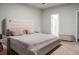 The spacious bedroom boasts a walk-in closet, an ensuite bath, and is bathed in natural light at 513 Donnas View Way, Summerville, SC 29486