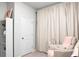 A Bedroom area includes a comfortable chair with a side table and elegant window coverings at 513 Donnas View Way, Summerville, SC 29486