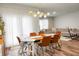 Spacious dining area featuring wood table, modern lighting and seamless flow to the living room at 513 Donnas View Way, Summerville, SC 29486