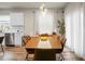 Dining area with modern light fixture, table with seating, and connection to the kitchen at 513 Donnas View Way, Summerville, SC 29486