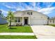 Charming two-story home with a well-manicured lawn and inviting front porch at 513 Donnas View Way, Summerville, SC 29486