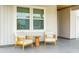 Cozy front porch seating area with stylish chairs and a small table, offering a relaxing outdoor space at 513 Donnas View Way, Summerville, SC 29486