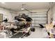 Well-organized garage featuring a jet ski on a trailer, ample storage space, and epoxy flooring for easy maintenance at 513 Donnas View Way, Summerville, SC 29486