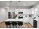 This modern kitchen features stainless steel appliances, a center island with seating, and stylish pendant lights at 513 Donnas View Way, Summerville, SC 29486