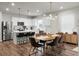 Open concept kitchen and dining area with stainless appliances, island, and seating at 513 Donnas View Way, Summerville, SC 29486