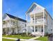 Charming two-story home with a welcoming front porch and a beautifully landscaped yard in a modern neighborhood at 515 Ivy Green Ln, Summerville, SC 29486