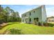 Green backyard with a well-maintained lawn and a view of the two-story home at 517 Yukon Ct, Summerville, SC 29485