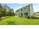 Green backyard with a well-maintained lawn and a view of the two-story home at 517 Yukon Ct, Summerville, SC 29485