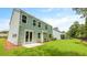 Backyard featuring a green lawn, patio, and a view of the home's exterior at 517 Yukon Ct, Summerville, SC 29485