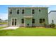 Spacious backyard featuring a lush lawn, patio, and a charming lake view at 517 Yukon Ct, Summerville, SC 29485