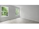 Bright bedroom with plush carpeting and two large windows offering natural light at 517 Yukon Ct, Summerville, SC 29485