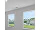 Bedroom with natural light from two windows overlooking the surrounding neighborhood at 517 Yukon Ct, Summerville, SC 29485