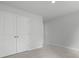 Bedroom featuring neutral paint, carpet, and a spacious double-door closet at 517 Yukon Ct, Summerville, SC 29485