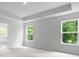 Spacious bedroom with tray ceiling, ample natural light, and neutral carpet at 517 Yukon Ct, Summerville, SC 29485