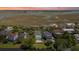 Aerial view of a lovely marsh community with backyard pools surrounded by lush trees and landscaping at 764 Post Oak Dr, Mount Pleasant, SC 29464