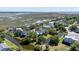 Aerial view of a lovely neighborhood near a marsh with waterfront houses and lush greenery at 764 Post Oak Dr, Mount Pleasant, SC 29464
