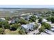 Aerial view of a neighborhood of waterfront homes along the marshy coast line and winding roads at 764 Post Oak Dr, Mount Pleasant, SC 29464