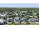 Beautiful aerial view of homes in a community with lush trees and a distant view of the city at 764 Post Oak Dr, Mount Pleasant, SC 29464