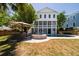 Charming backyard with a pool, hot tub, outdoor seating, and patio umbrella at 764 Post Oak Dr, Mount Pleasant, SC 29464